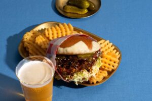 appetiser. magazine 9 A picture of a Korean fired chicken hamburger